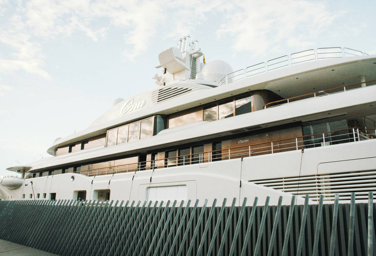 Yacht captain reviewing elite yacht protection coverage on tablet
